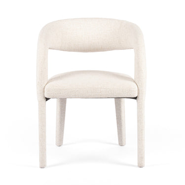 An image of an Haven Dining Chair with a sculpted wrap frame and off-white performance fabric.